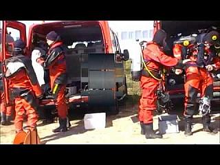 Five gorgeous Black and Red Viking Drysuit Divers Suiting Up