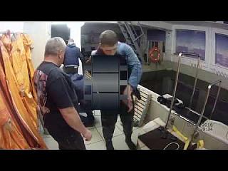 Hot Black Rubber Drysuit Russian Diver coming out of Dive Pool and Desuiting inc Hot Socks