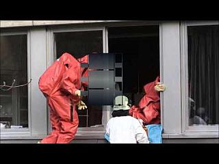 Red Isotemp Hazmat Suits in Action