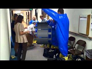 Guy suiting up in Blue Level B Waterproof Chemical Suit