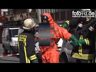 Stripping out of Orange Waterproof Level B Chemical Suit with Black Socks