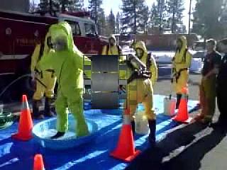 Evan getting decon in hazmat suit