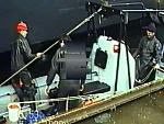 Black Rubber Drysuit Divers in Action on Ship