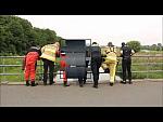 Drysuit Divers on Bridge Open Suit Zippers Bum then pulling up Drysuit
