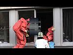 Red Isotemp Hazmat Suits in Action