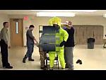 Suiting up in Hazmat Suit indoors for Training