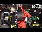 Stripping out of Orange Waterproof Level B Chemical Suit with Black Socks