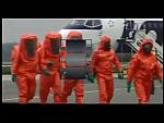 Orange Hazmat Suits at Airport Hazmat Incident
