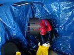 dressing up in yellow rainsuit with gasmask